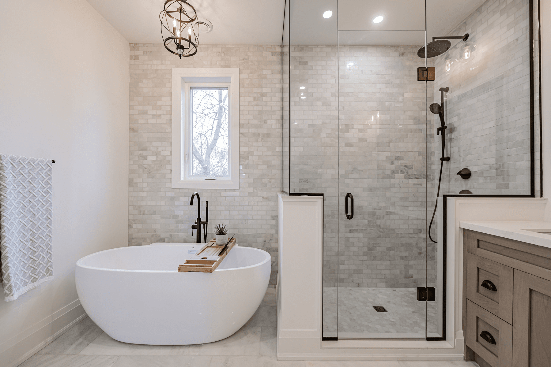 Bathroom renovation showcasing new tile work and contemporary styling