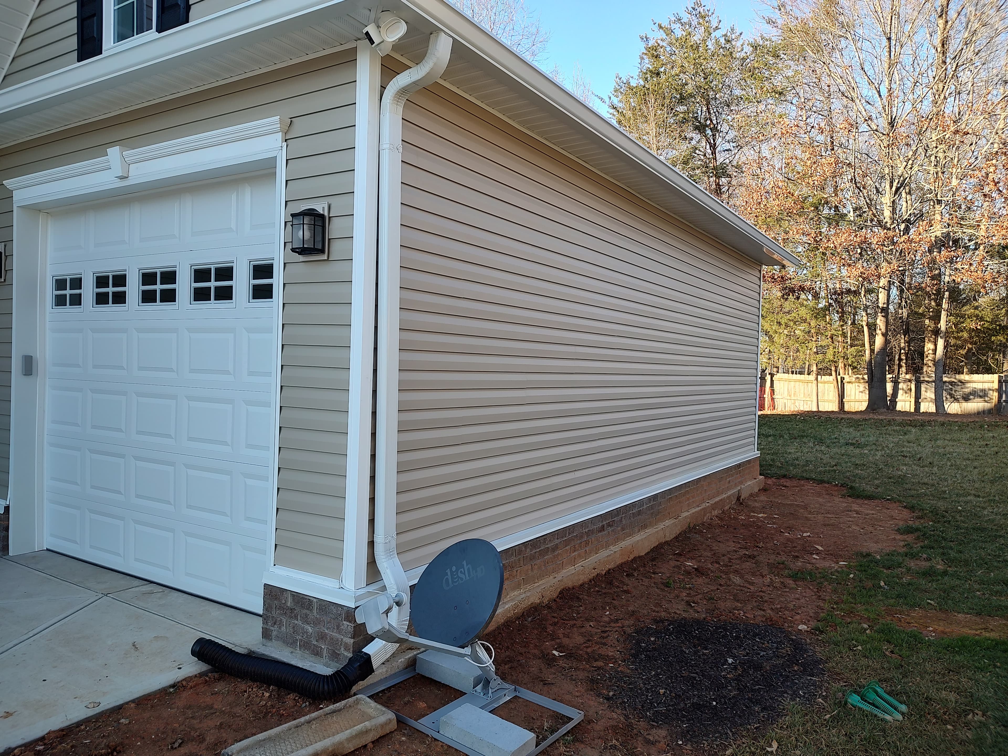 Garage makeover with overhead storage racks and wall systems