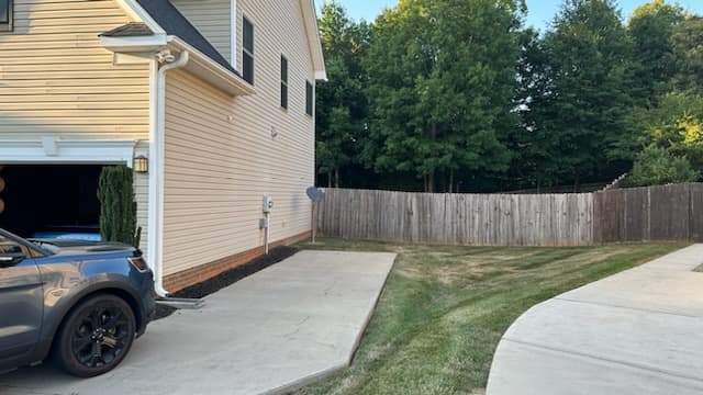 Unfinished garage with exposed framing before renovation